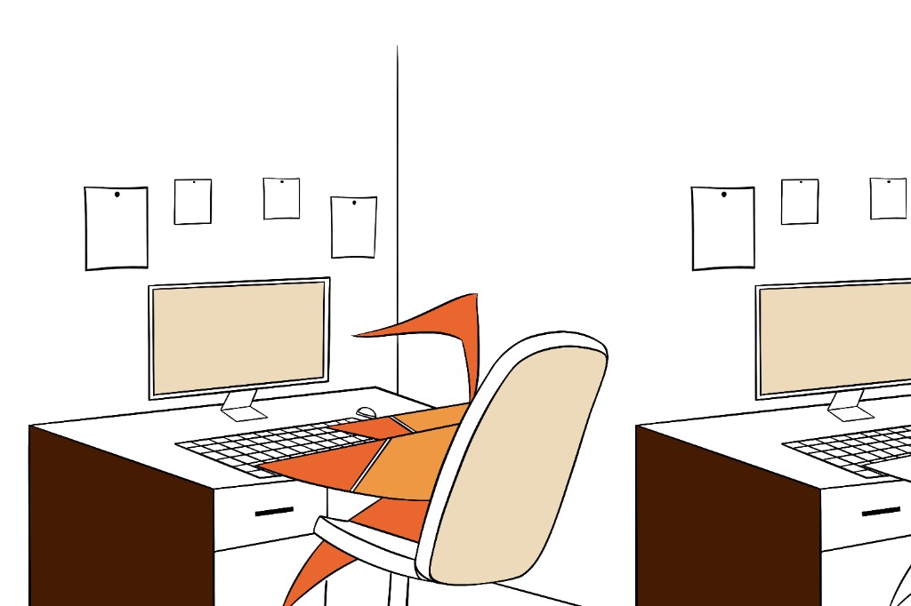 Origami bird working on a computer at an office desk